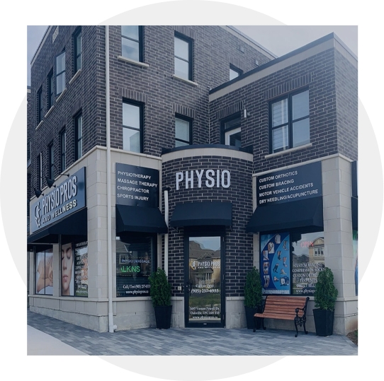 Entrance into a building with a sign that says "PHYSIO" in white